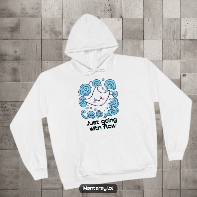 Funny Hoodie depicting a happy manta ray with mystical glowing eyes, elegantly swimming through swirling water, a cozy, radiant sea creature.