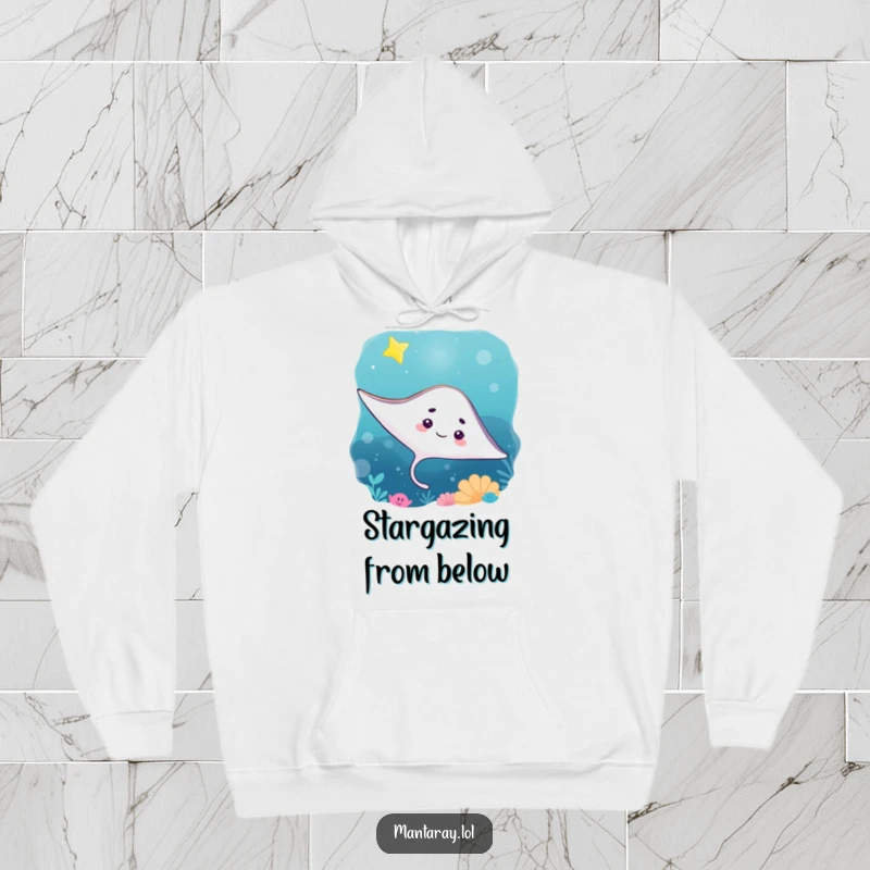 Funny Hoodie depicting a curious manta ray gazing upwards at a twinkling star in the deep ocean, a symbol of curiosity and warmth.