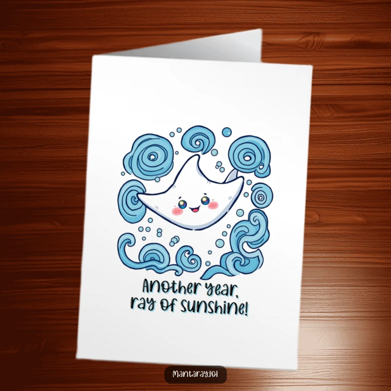 Funny free printable Happy Birthday card: A happy manta ray with glowing eyes swims gracefully in swirling ocean patterns.